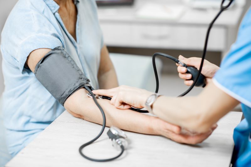 nurse measuring blood pressure
